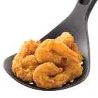 Fried shrimp in the deep fryer's scoop.