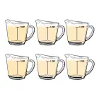 Six measuring cups filled with cooking oil.