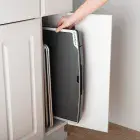 The Tilt-n-Fold XL Electric Griddle being stored in a kitchen cabinet.