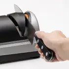 A knife being sharpened in stage three of the Professional EverSharp three-stage electric knife sharpener.