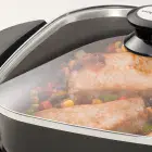 A close-up of the 11-inch Electric Skillet's glass cover.