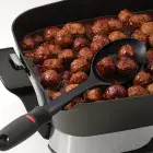 A close-up of the 16-inch Electric Foldaway skillet showing the built-n spout.