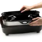 A close-up showing the skillet base being stored in the pan.