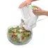 The SaladShooter® electric slicer/shredder slicing a radish into a salad.
