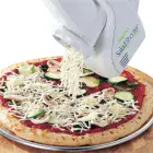 The SaladShooter&reg; electric slicer/shredder shredding cheese onto a pizza.