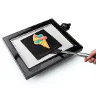 The PanGogh Pancake Art Griddle with an art template being flapped.