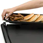 A close-up of the Cool-touch Electric Griddle/Warmer Plus with tray being removed for serving.