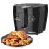 The CoolDaddy cool-touch deep fryer with the cover closed and a plate of fried food in the foreground.