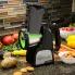 The Professional SaladShooter&reg; electric slicer/shredder and a variety vegetables on a kitchen counter.