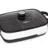 The Presto Precise 16-inch Tuxedo digital precision skillet multi-cooker with the cover on and the cooking rack in the pan.