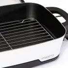 A close-up of the Presto Precise 16-inch Tuxedo digital precision skillet showing the multi-purpose rack in the pan.