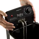 A close-up of hands removing the heating element from the Stainless Steel ProFry immersion element deep fryer.