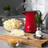 The PopLite hot air popper on a kitchen counter with popped corn in a bowl.