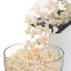 A close-up of the chute of the Orville Redenbacher's hot air popper by Presto with popped corn flowing into a bowl.