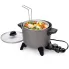 The Kitchen Kettle deep fryer/multi-cooker with the basket hooked to the rim. Steamed vegetables are in the basket.