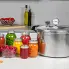 The 16-Quart Pressure Canner and seven jars of canned food on a kitchen counter.