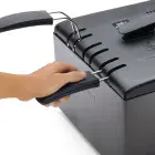 A close-up of the Dual Basket ProFry immersion element deep fryer with a hand lowering a basket with the cover on.