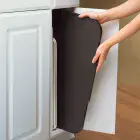The 22-inch Electric Griddle being stored in a kitchen cabinet.
