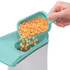 The butter melter being used to pour popcorn kernels into the PopLite hot air popper.