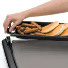 A close-up of the Cool-touch Electric Griddle/Warmer Plus with tray being removed for serving.