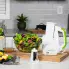 The SaladShooter® electric slicer/shredder with a salad on a kitchen counter.