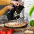 The Professional SaladShooter&reg; electric slicer/shredder on a kitchen counter and shredding cheese onto a pizza.