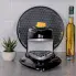 The Pizzazz Plus rotating pizza oven stored on a kitchen counter.
