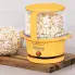 The Showtime gourmet popper on a cutting board with the cover filled with popped popcorn.