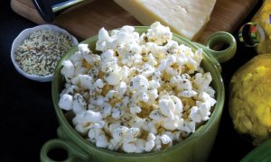 Cheesy Popcorn Italiano in a green serving bowl