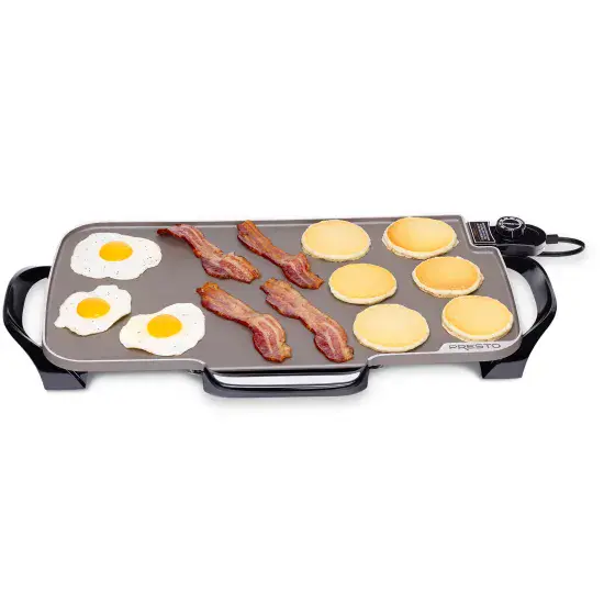 07062 22-inch Electric Griddle cooking bacon, eggs, and pancakes.