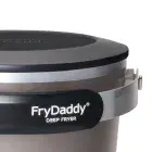 A close-up of the top of the FryDaddy electric deep fryer with the snap-on lid in place .