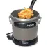The FryDaddy electric deep fryer with the scoop containing French fries.