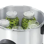 The Presto Precise 16-Quart Digital Pressure Canner with the cover off and jars of green beans in the canner.