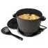 The DualDaddy electric deep fryer with the cover off and food frying inside. The scoop is in front of the fryer.
