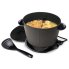 The DualDaddy electric deep fryer with the cover off and food frying inside. The scoop is in front of the fryer.