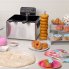 The Dual Basket ProFry immersion element deep fryer with the cover off. Donuts are along side the fryer and in the foreground.