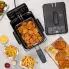 An overhead view of the Stainless Steel ProFry immersion element deep fryer on a kitchen counter. The cover off and fried food is in the basket and on the counter.
