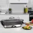 The 16-inch Electric Foldaway Skillet on a kitchen counter with the cover on.