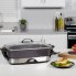 The 16-inch Electric Foldaway Skillet on a kitchen counter with the cover on.