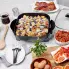The 12-inch Electric Skillet on a kitchen counter with a breakfast recipe cooking in the pan.