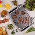 An overhead view of the Tilt-n-Fold XL Electric Griddle cooking breakfast sausage and bacon.