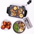 An overhead view of the Liddle Griddle mini-griddle cooking pork chops