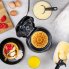 An overhead view of the Belgian Waffle Bowl Maker with the cover open and a waffle bowl on the cooking grid. Various ingredients and fillings are around the unit.