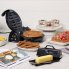 The FlipSide Belgian Waffle Maker on a kitchen counter. A baked waffle is on the cooking grid and other breakfast foods are around the waffle maker.