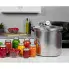 The 23-Quart Pressure Canner on a kitchen counter with jars of canned food.