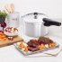 The 8-Quart Aluminum Pressure Cooker on a kitchen counter with a beef roast.