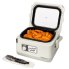 The Presto Nomad Traveling Slow Cooker with the cover open and chicken wings in the pot.