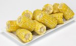 Cooked corn-on-the-cob on a platter.