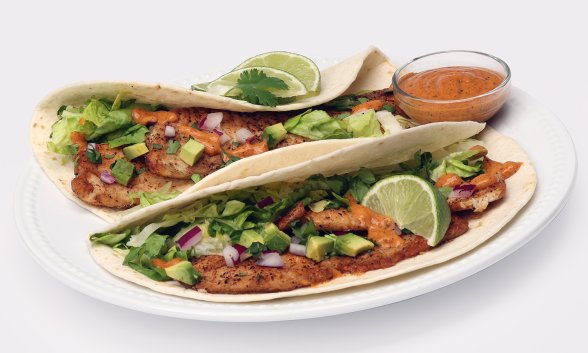 Two fish tacos on a plate.