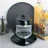 The Pizzazz Plus rotating pizza oven stored on a kitchen counter.